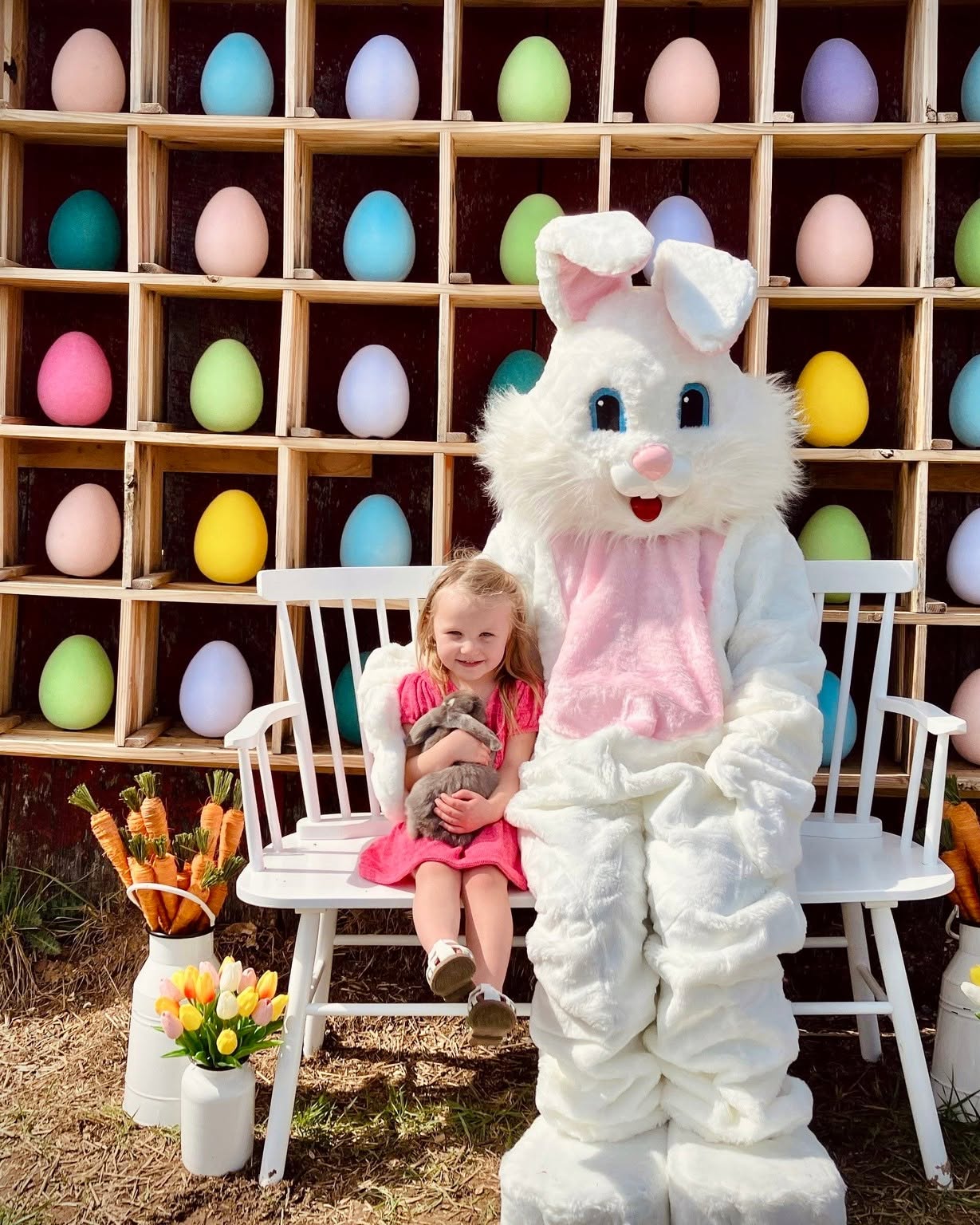 The Easter Bunny at the egg wall during the spring festivals at Endless View Farms