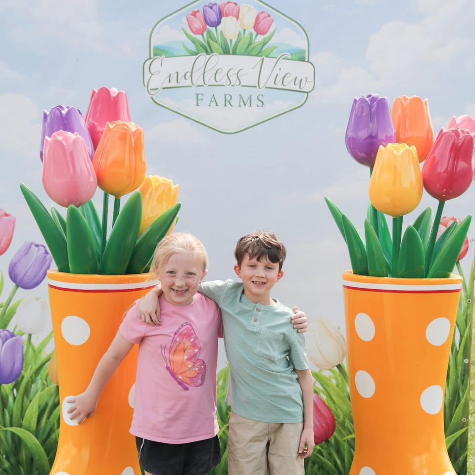 Kids in the tulip fields during the Easter Festival at Endless View Farms
